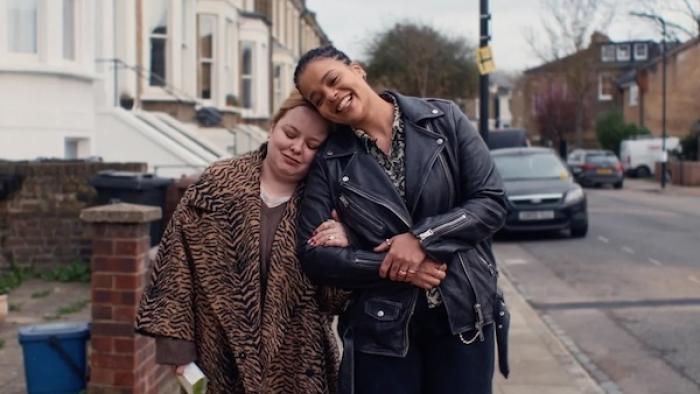 Big Mood TV show screenshot 3: Maggie and Eddie walking down a sidewalk arm-in-arm, heads resting together with smiles on their faces