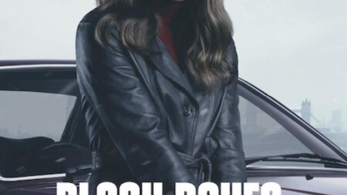 Black Doves TV show screenshot 1: Ben Whishaw and Keira Knightly sit in a car. Whishaw grips the steering wheel and Knightly’s face is bloodied.