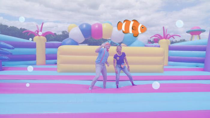 Blippi's Ultimate Bounce House Challenges TV: Blippi and Meekah pretend to be underwater in sea-monster themed bounce house. Digital clownfish appears