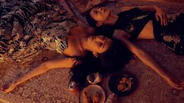 Born for the Spotlight TV show screenshot #1: Two young Asian women lie on the floor
