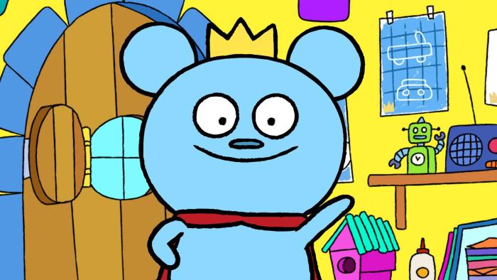Bossy Bear, an animated blue bear with a crown, waves hello. 