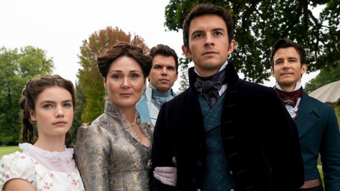 Bridgerton Season 1 TV show screenshot 2: Hyacinth, Violet, Anthony, Benedict and Colin stand together outdoors, dressed in Regency daywear