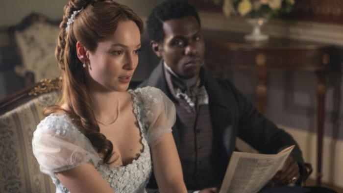 Bridgerton Season 4 TV show screenshot 2: Francesca and John sit together on a couch, staring discontentedly