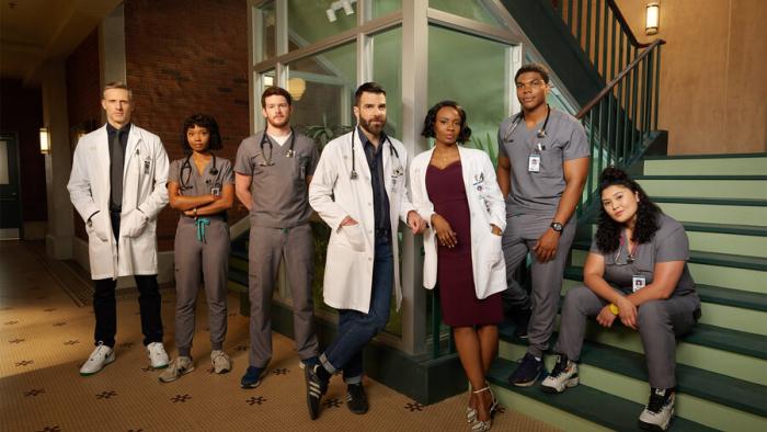Brilliant Minds TV show screenshot: A group of male and female, white, black and Latino, doctors stands next to each other.