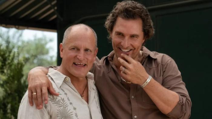 Brothers TV show screenshot 3: Matthew McConaughey has an arm thrown around Woody Harrelson's shoulder as both of them share a laugh