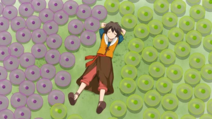 By the Grace of the Gods TV show: Ryoma happily lays down in a grassy field surrounded by his purple and green slime pets.