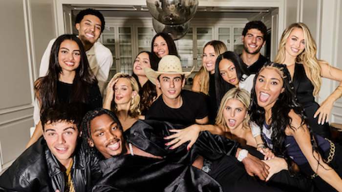 Calabasas Confidential TV show screenshot 3: Cast posing indoors, some sitting, others standing.