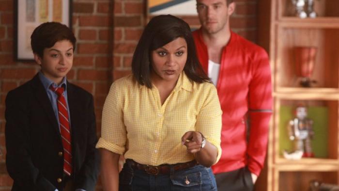 Champions TV Series: A woman stands in front of a man and a teen boy; the woman is pointing her finger and looks stern. 