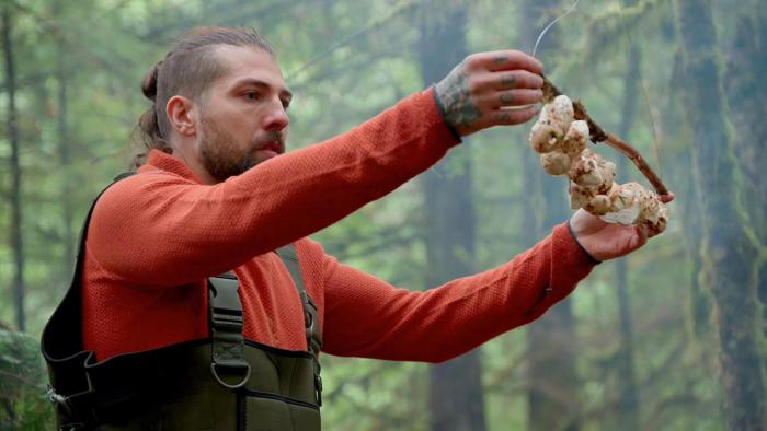 Chefs vs. Wild TV Show: a chef prepares mushrooms in the wild