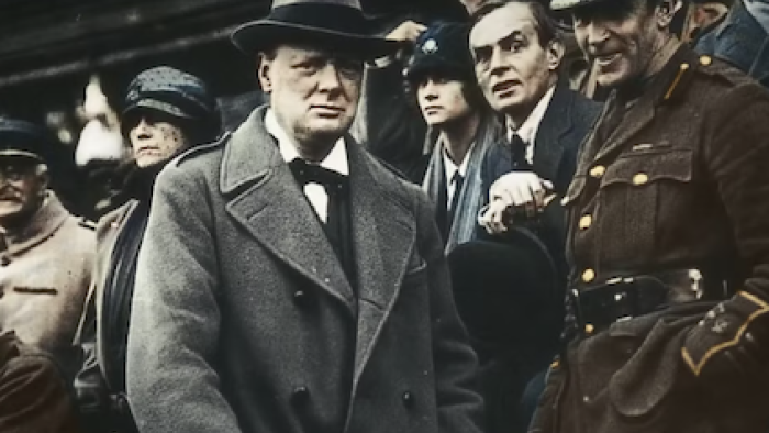 Churchill at War screenshot 1: Winson Churchill stands near military and statesmen. 