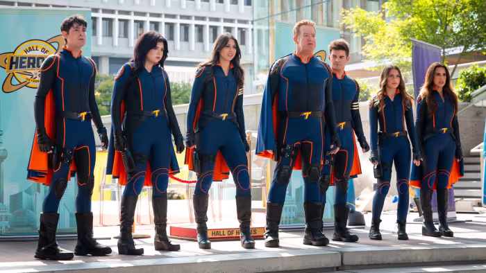 Clash of the Thundermans TV show screenshot 1: the Thundermans in their superhero uniforms at the Hall of Heroes ceremony