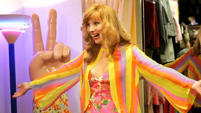 The Comeback TV show: Valerie in a bright outfit with her arms outstretched
