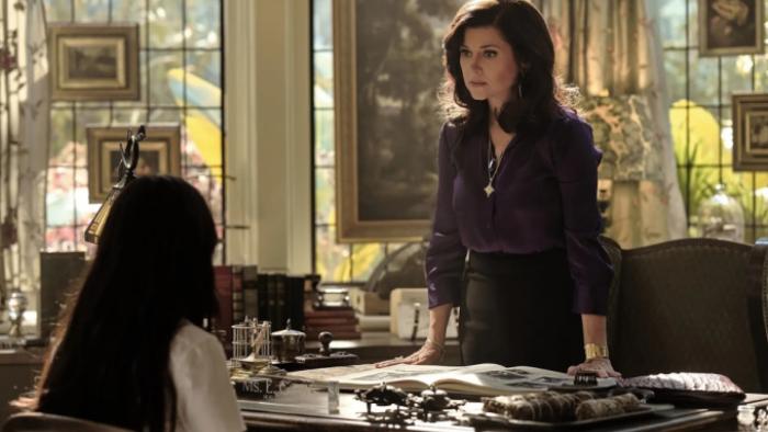 Coven Academy TV show screenshot 3: Miss Graves stands up behind her desk in a scene set in her office; Briar sits in front of her