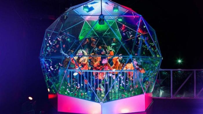 The Crystal Maze TV show: A family grabbing as many foil tokens as they can in the Crystal Dome.