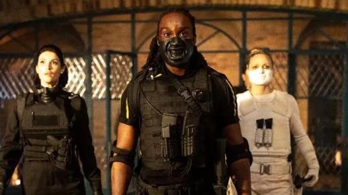 Culprits TV show screenshot 3:  a man and two women in military gear and masks