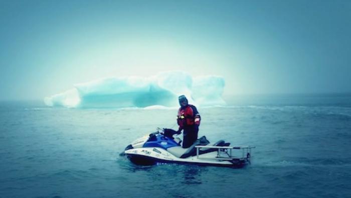 Dangerous Waters TV Series: A man on a JetSki looking at icebergs. 