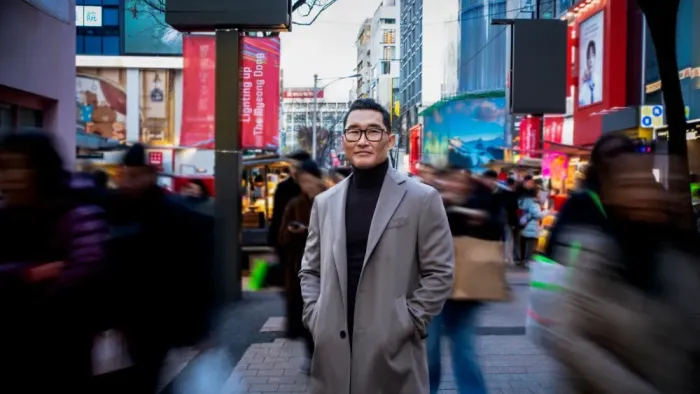 K-Everything TV show screenshot: Daniel Bae Kim stands on a busy city street