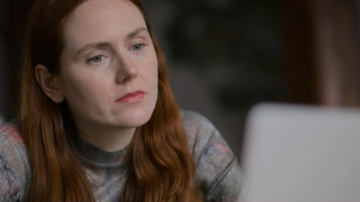 Desperately Seeking Soulmate screenshot 1: Alice Hines looks at her computer. 