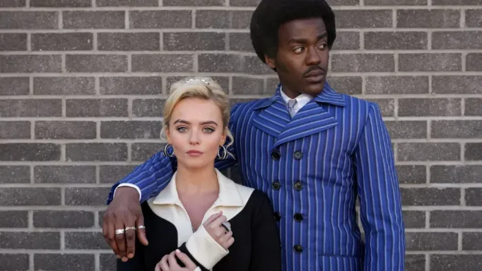 Doctor Who TV Show: Ncuti Gatwa in blue pinstripe suit as the Doctor with arm around Millie Gibson, his companion