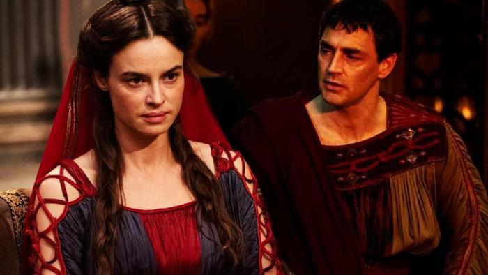 Domina: A white woman looks bored as a white man tries to talk to her.