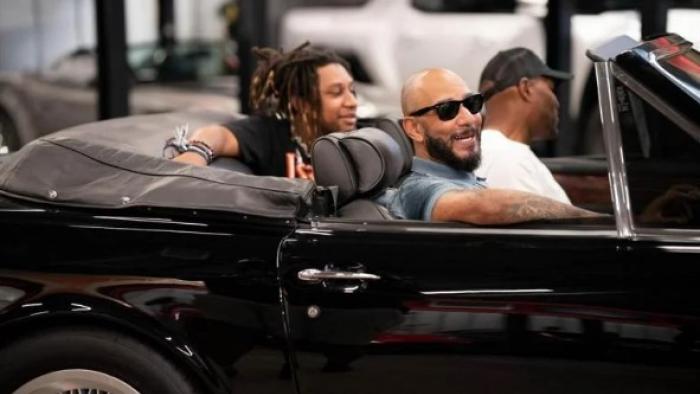 Drive with Swizz Beatz: Beatz (front seat) and his son Nasir (back seat) ride in a black convertable