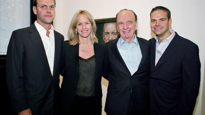 Dynasty: The Murdochs screenshot: Lachlan, Liz, Rupert and James Murdoch stand with their arms across each other.
