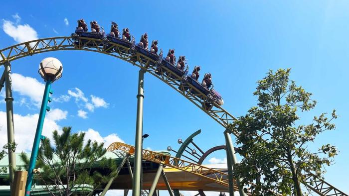 Inside the Worlds of Epic Universe TV show screenshot: A group of people ride a roller coster.
