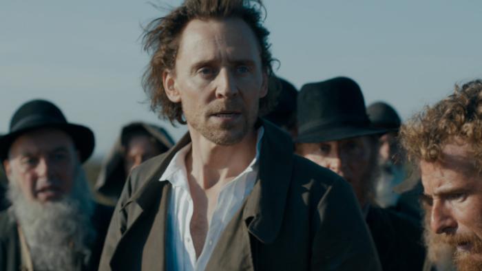 The Essex Serpent: Will stands in front of a crowd of men dressed in gray; they all appear distressed