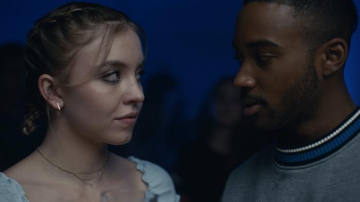 Euphoria TV Series: Cassie and Chris stand close together at a party