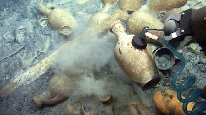 Removing an ancient vessel from a wreck. 