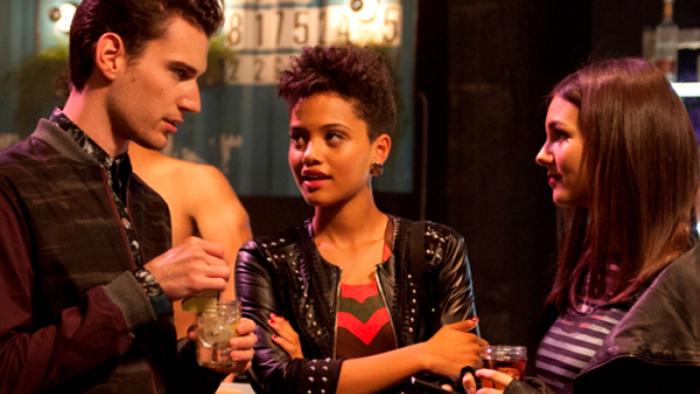 Eye Candy: Three young people talk at a gathering