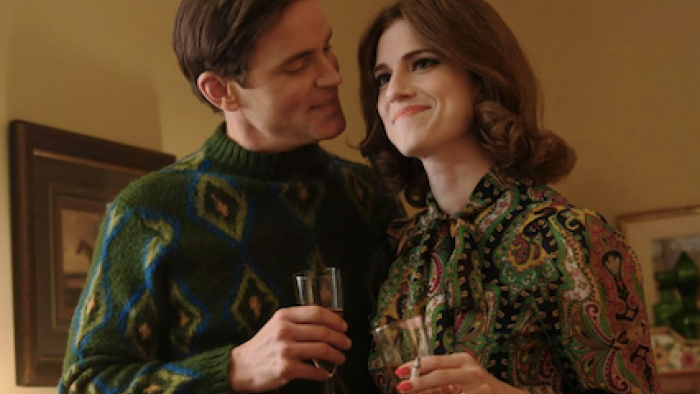 Fellow Travelers TV show screenshot 3: An older Hawks hugs Lucy during a toast. 