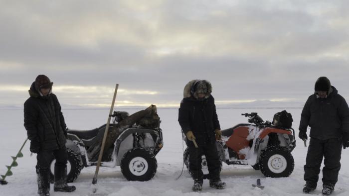 First Alaskans: Daniel Apassingok deep hole fishes with his two sons on the ice.