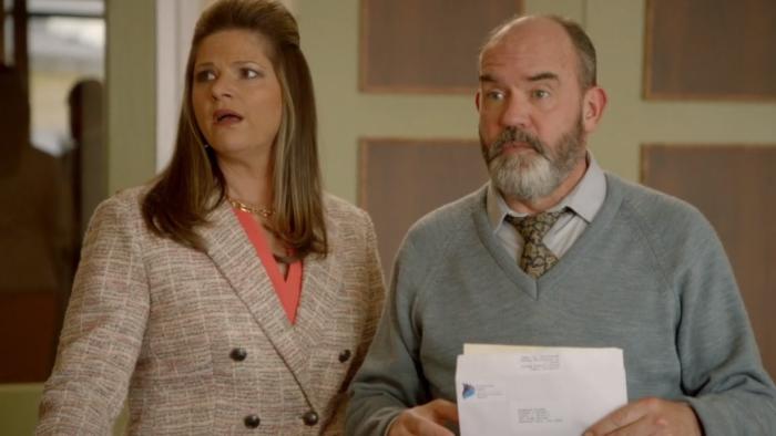 Fisk TV show screenshot 3: Julia Zemiro and Marty Sheargold look to the side in awe. Marty holds an envelope.