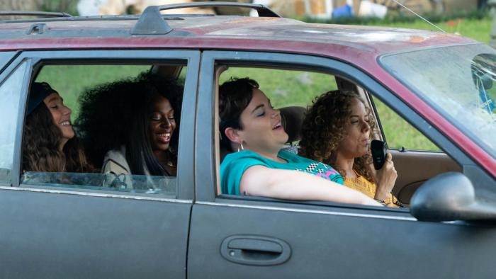 Florida Girls Television: Scene 3 Jayla, Erica, Kaitlin, and Shelby laugh together in a car as Shelby blows into a steering wheel breathalyzer.