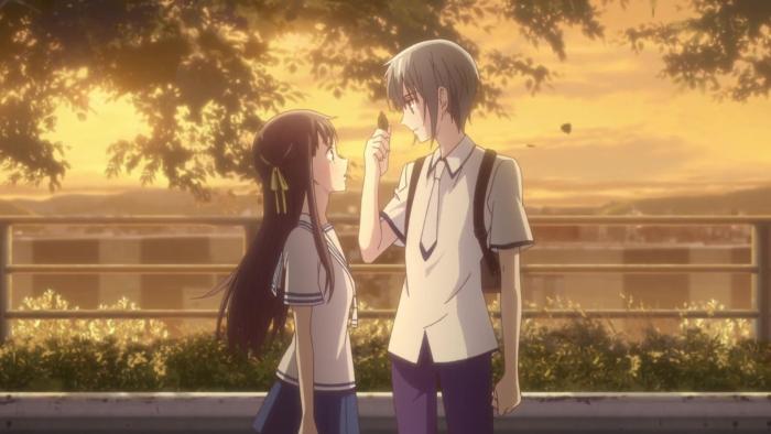 Fruits Basket: Yuki catches a leaf while talking to Tohru on a sunset walk