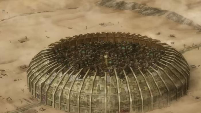 Gachiakuta TV show TV show screenshot 2: An aerial view of the Sphere city, surrounded by tan desert and a gigantic wall