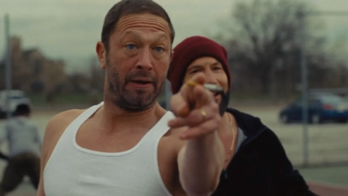 Gary TV show screenshot 2: Mikey in tank top gesturing forward while Richie in a beanie stands behind him.