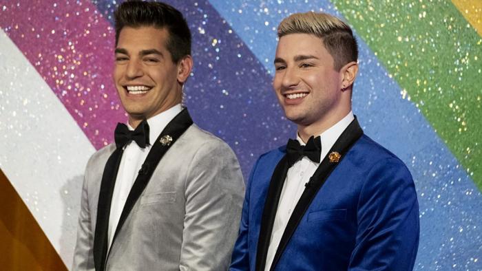 Gayme Show TV show: Matt Rogers and Dave Mizzoni wear velveteen lounge suits against a glitzy background