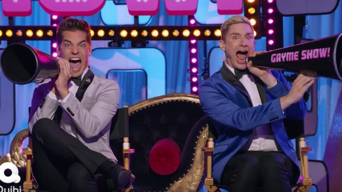 Gayme Show TV show: Rogers and Mizzoni shout into megaphones with exaggerated excited expressions