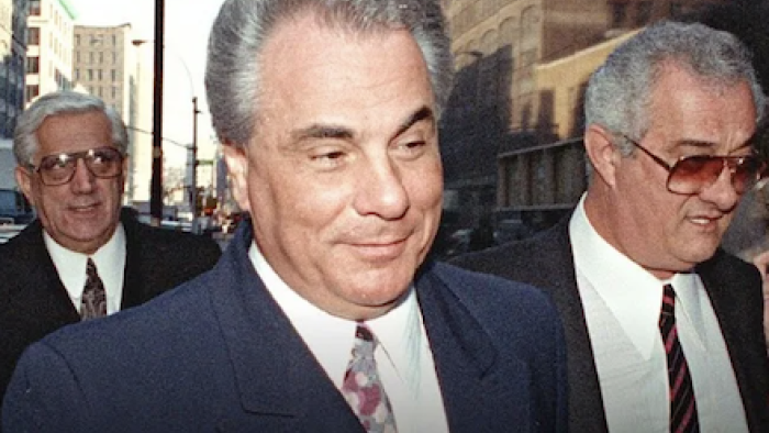 Get Gotti TV show screenshot 1: John Gotti smirks going into court. 