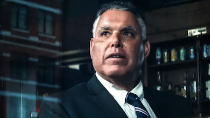 Get Gotti TV show screenshot 2: FBI Agent George Gabriel in dark suit and tie.