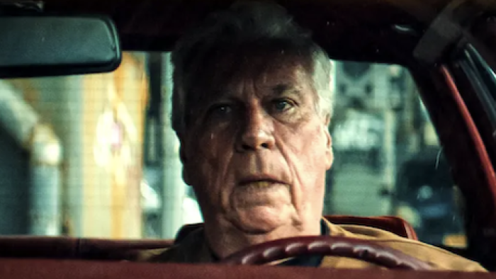 Get Gotti TV show screenshot 3: Frank O'Hara sits in driver side of car.  
