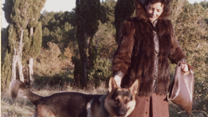 Gunther's Millions: Carlotta Von Liebenstein walks Gunther III outside among trees. 