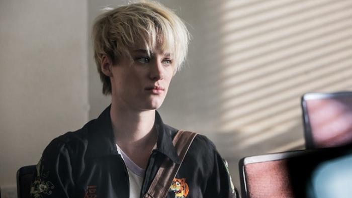 Halt and Catch Fire TV Show: Cameron with a dyed blonde pixie cut sits inside a lecture hall