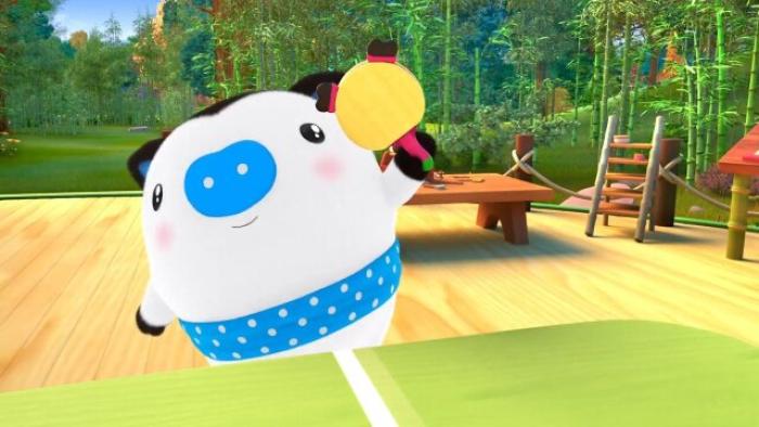 Po plays tennis with a yellow paddle in the brightly colored woods. 