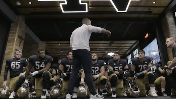 Here Come the Irish screenshot 3: Coach Freeman talks to Fighting Irish team sitting in front of him. 