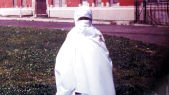 How I Escaped My Cult screenshot 2: A teenage Nuwaubian Nation member wearing white burka.