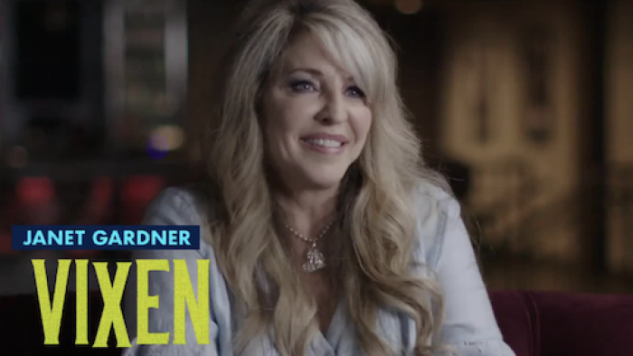 I Wanna Rock TV show screenshot 2: I Wanna Rock Screenshot 2: Janet Gardner sits with white shirt facing camera. 
