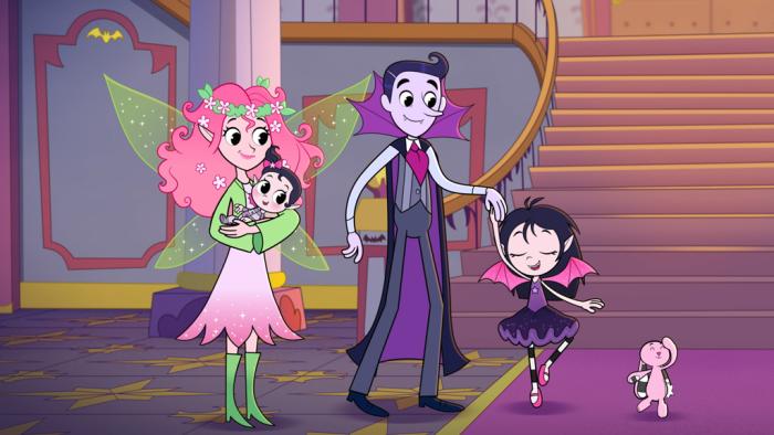 Isadora Moon TV show screenshot 1: Mom, the fairy, and Dad, the Vampire watch Isadora swirl. Her pet pink rabbit stands with her.
